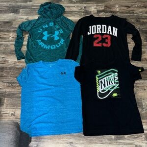 Boys large under Armour and Nike shirts